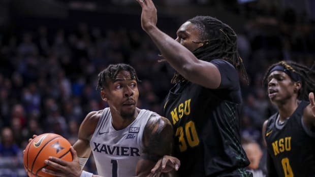 Nov 21, 2021; Cincinnati, Ohio, USA; Xavier Musketeers guard Paul Scruggs (1) drives to the basket against Norfolk State Spartans forward Kris Bankston (30) in the first half at Cintas Center. Mandatory Credit: Katie Stratman-USA TODAY Sports